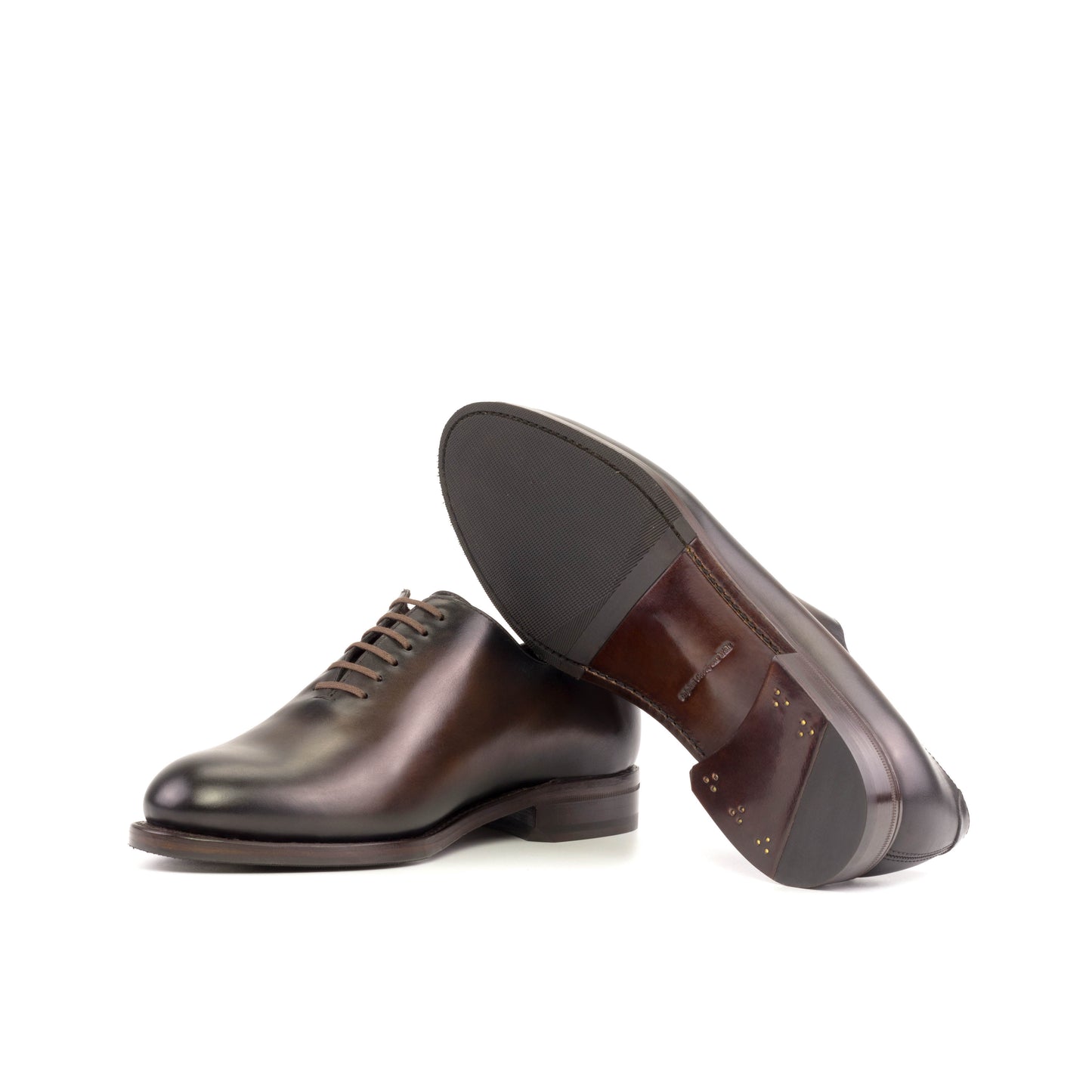 Whole cut dark brown Goodyear Welt, mixed leather and rubber sole